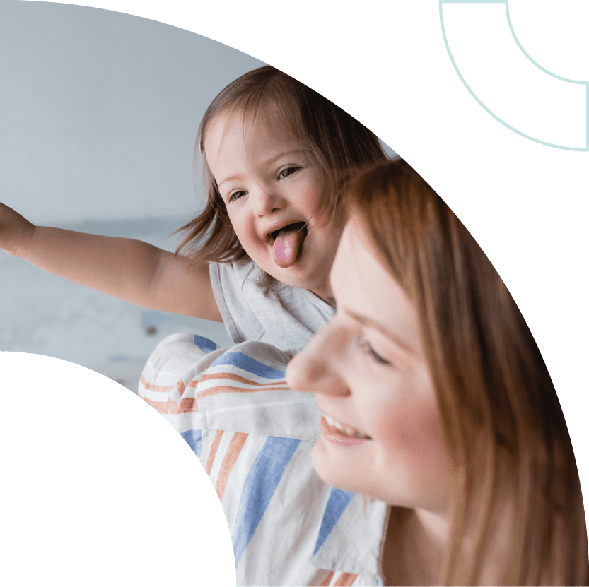 Little girl and woman smiling.