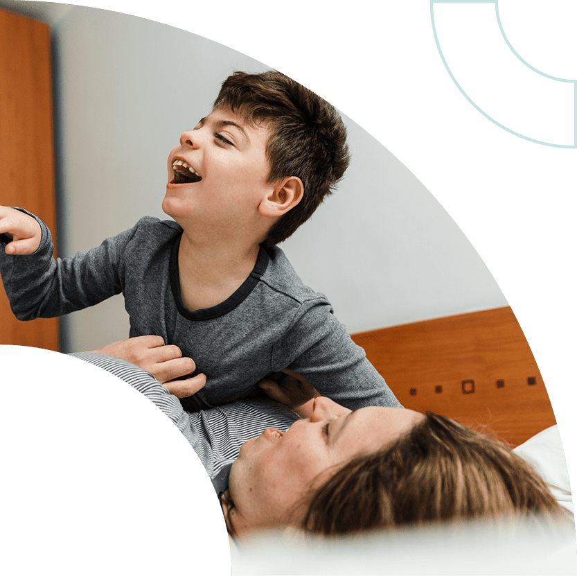 A woman and child smiling.